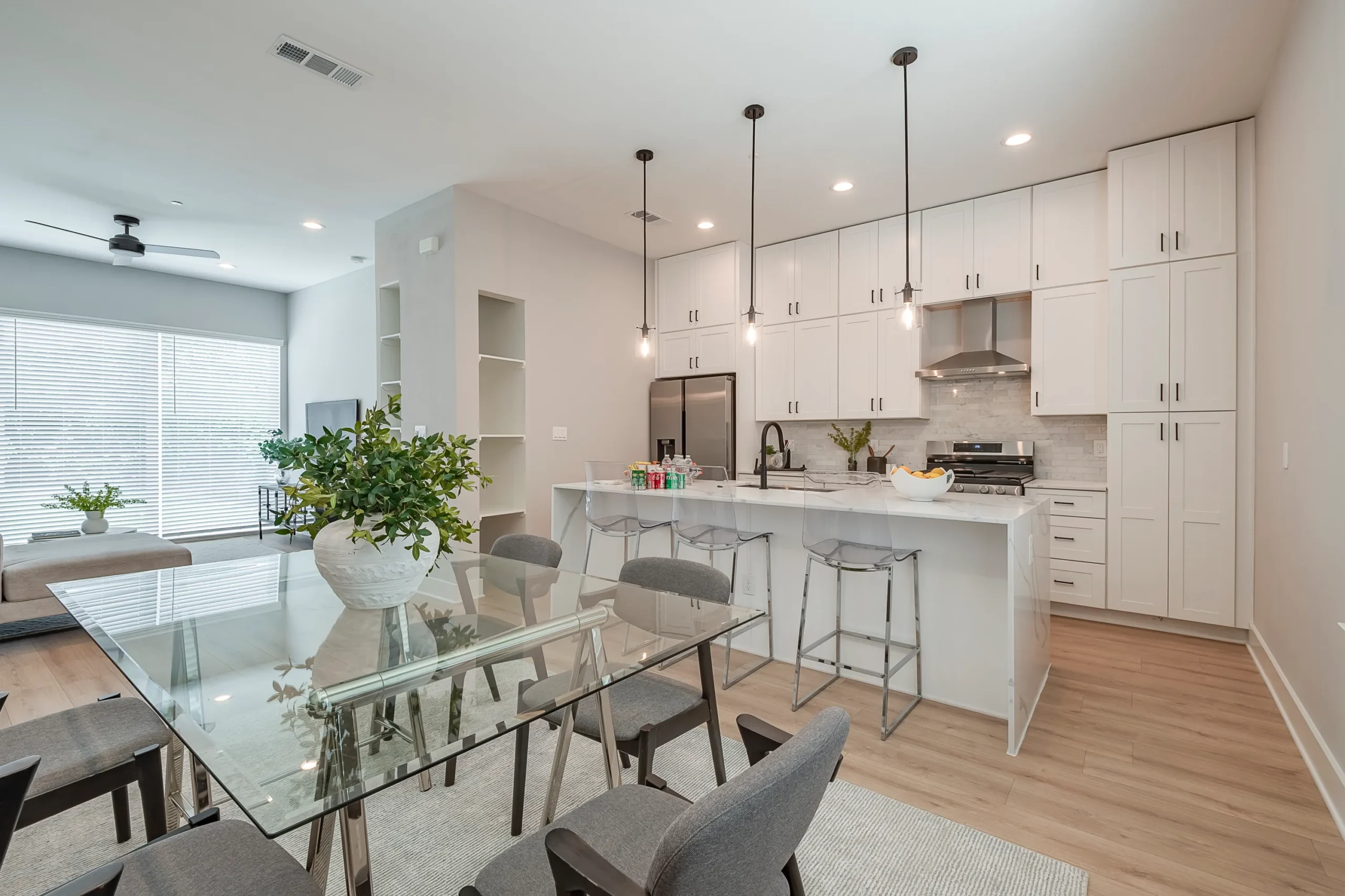 Modern luxury townhome interior with open concept kitchen and dining area, built by Rody Group in Dallas N. Carroll Ave